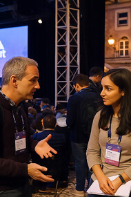 Attendees network during Web Summit in Lisbon, where talks, meetups, and the Night Summit bring together global leaders, innovators, and entrepreneurs