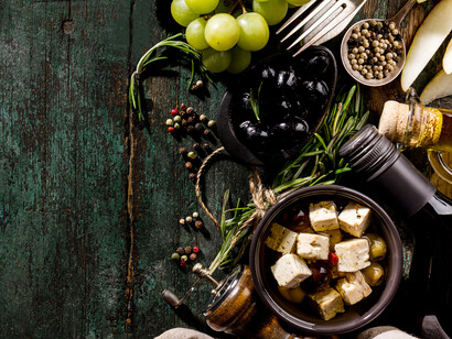 Classic ingredients used in Greek cuisine, such as grapes and olive oil