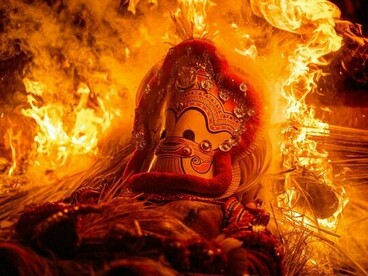 A Theyyam ritual taking place in the warmth of fire, symbolising the traditions that make every region of India fascinating
