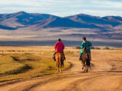 As the golden sun sets over the endless Kazakh steppes, a herdsman leads his cattle across the wind-swept plains, echoing the centuries-old traditions of those who once called this land home