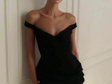 A woman wearing a modern little black dress, exuding elegance