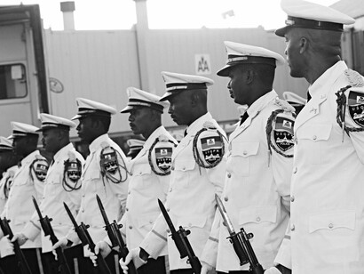Members of the Haitian National Police Force stand at parade rest at Toussaint Louverture International Airport in Port-au-Prince (2010)
