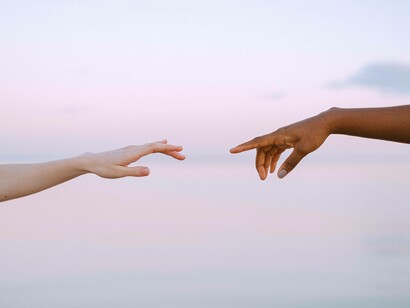 Two hands move towards eachother
