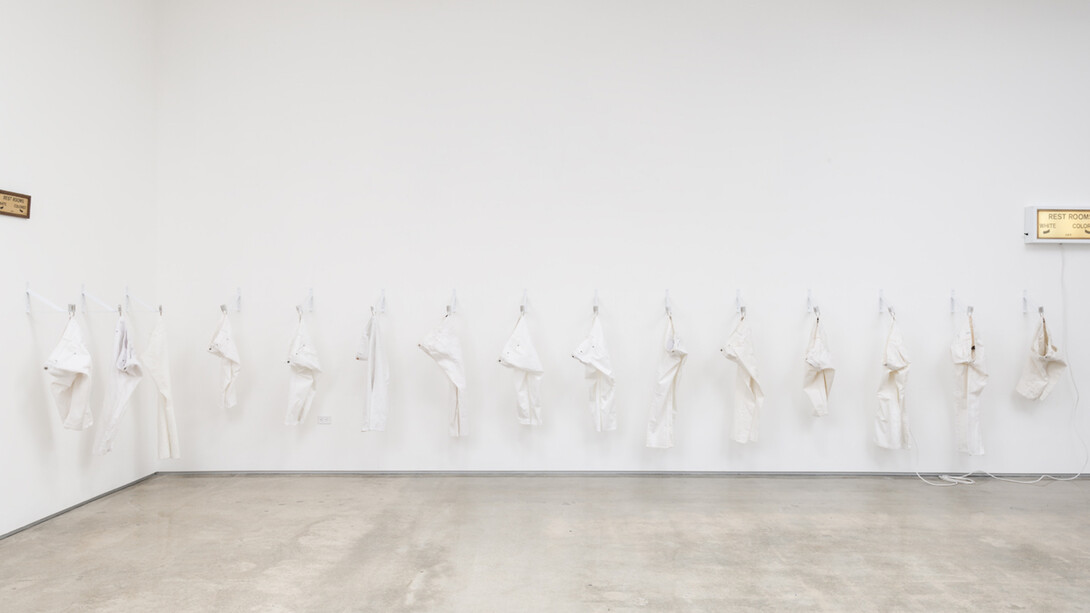 Kendell Carter, Cranes for Solange, 2017, Shelving brackets, denim jeans, locks, lightbox, found ephemera. Courtesy of Edward Cella Art & Architecture 