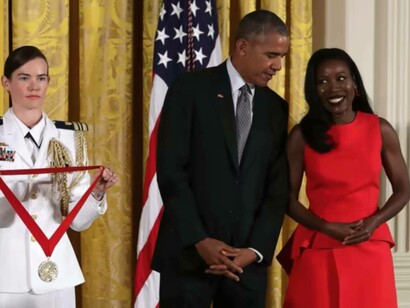 Isabel Wilkerson, the author, standing with then-President, Barak Obama about to receive the Pulitzer Prize