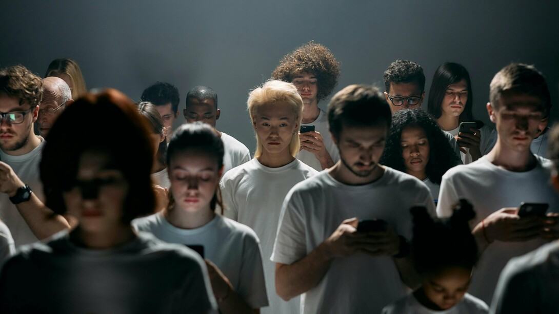 A group of people sharing the same space but removed from each other