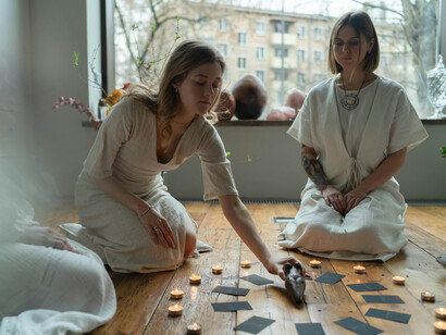 With hands resting on hearts and eyes closed, the group enters a moment of stillness, connecting with universal energy to shape their destinies