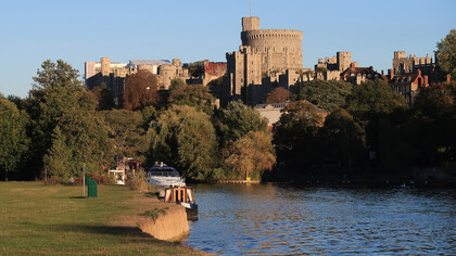 Windsor Castle viewed across the River Thames, reflecting England’s historic royal landscape, UK