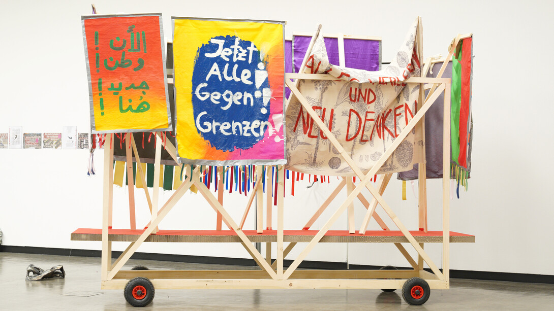 Installation view: ... of bread, wine, cars, security and peace, Kunsthalle Wien 2020, photo: Kunsthalle Wien: Marina Naprushkina, Jetzt! Alles für Alle!, 2019, courtesy the artist

