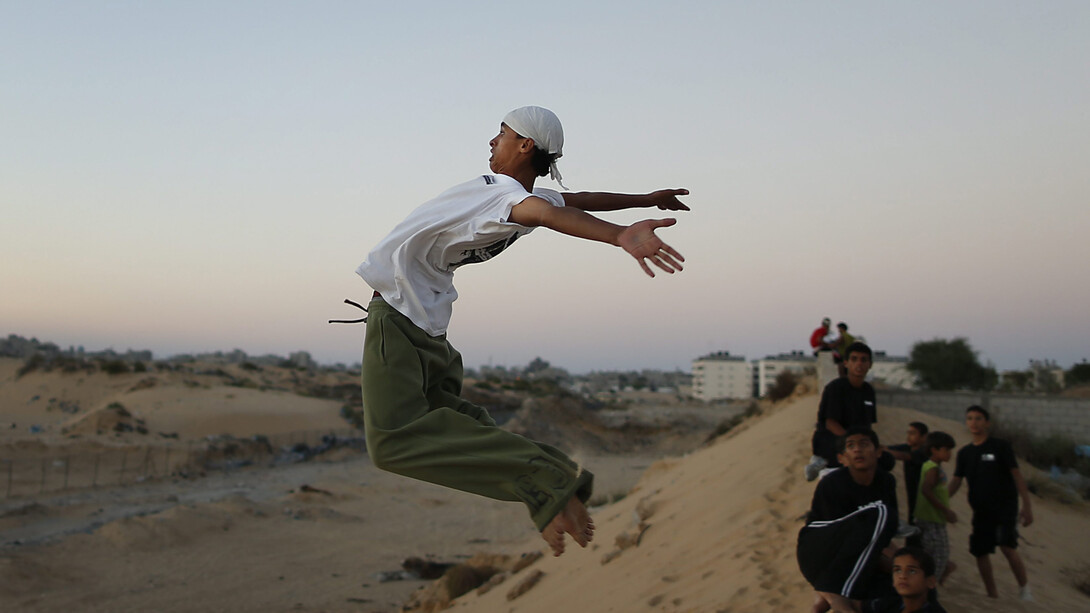 Palestinian boy practices parkour in Khan Younis, southern Gaza