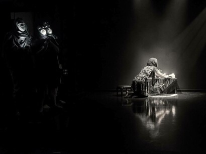 Use of symbols and imagery in the devised piece 'A Floating Caravan Under the Moon' directed by Chiara D'Anna