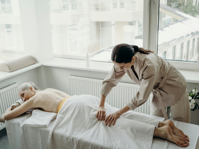 A woman enjoys a relaxing day with a massage therapist