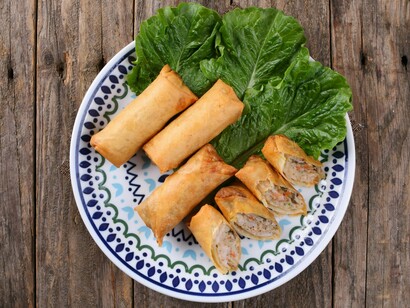 Crispy Chinese spring rolls arranged on a decorative plate, symbolising the rich heritage of Chinese cuisine