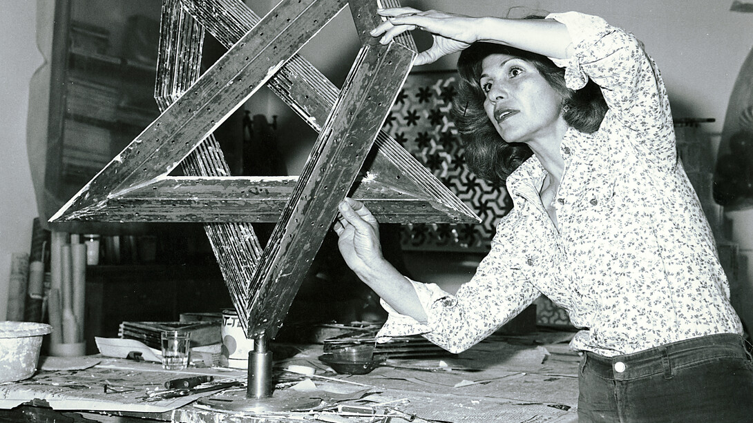 Monir Shahroudy Farmanfarmaian in her studio working on Heptagon Star, Tehran, 1975. Photo: Courtesy of the artist and The Third Line, Dubai
