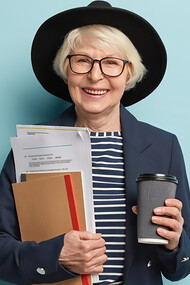 Senior woman holding documents and coffee