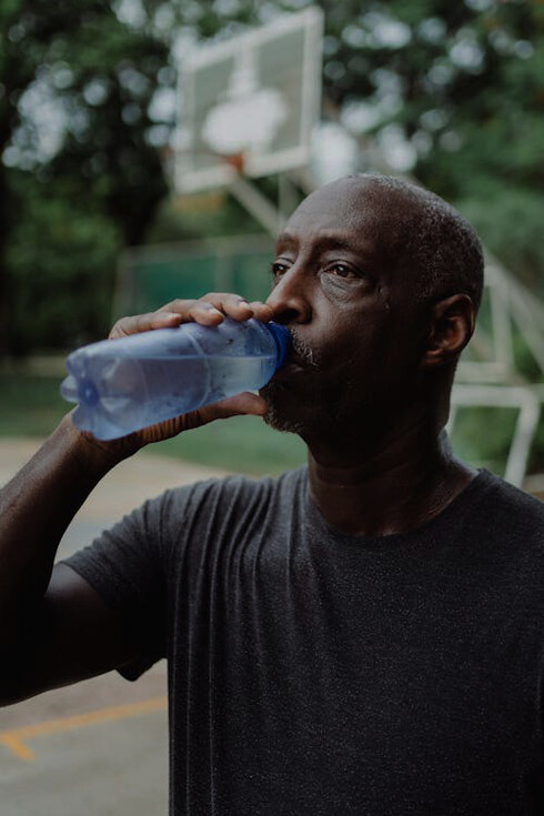 A moment of hydration post-workout aids in recovery, ensuring peak performance in daily activities