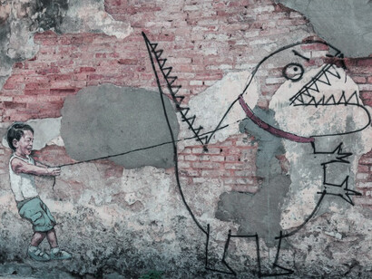 A red and white concrete wall in George Town, Penang, Malaysia, reflecting the city's unique architectural charm