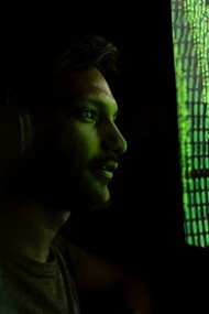 A person surrounded by floating algorithms symbolizes the overwhelming presence of AI in modern life
