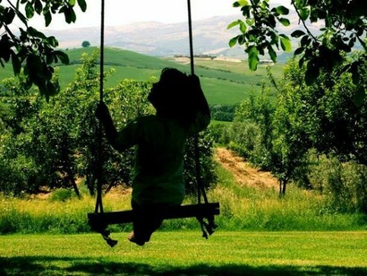Child playing in a seesaw