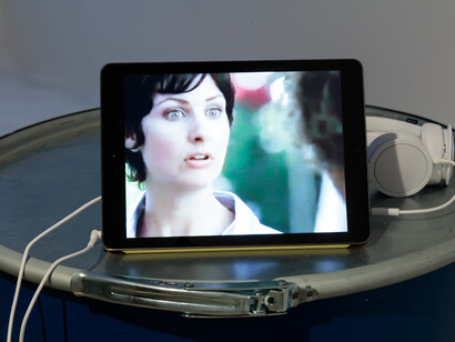 High Fructose Corn Syrup Advertisements by the American Corn Refiners Association, 2015, video on iPad, yellow iPad cover, headphones, 24 x 16.5 x 1 cm, 9 1/2 x 6 1/2 x 3/8 ins, courtesy of Vilma Gold, London and Neue Alte Brücke, Frankfurt
