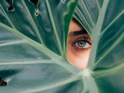 A deep gaze from behind a curtain