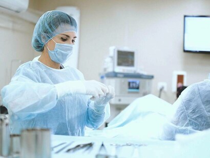 Doctor prepping for surgery on a patient who has PCOS