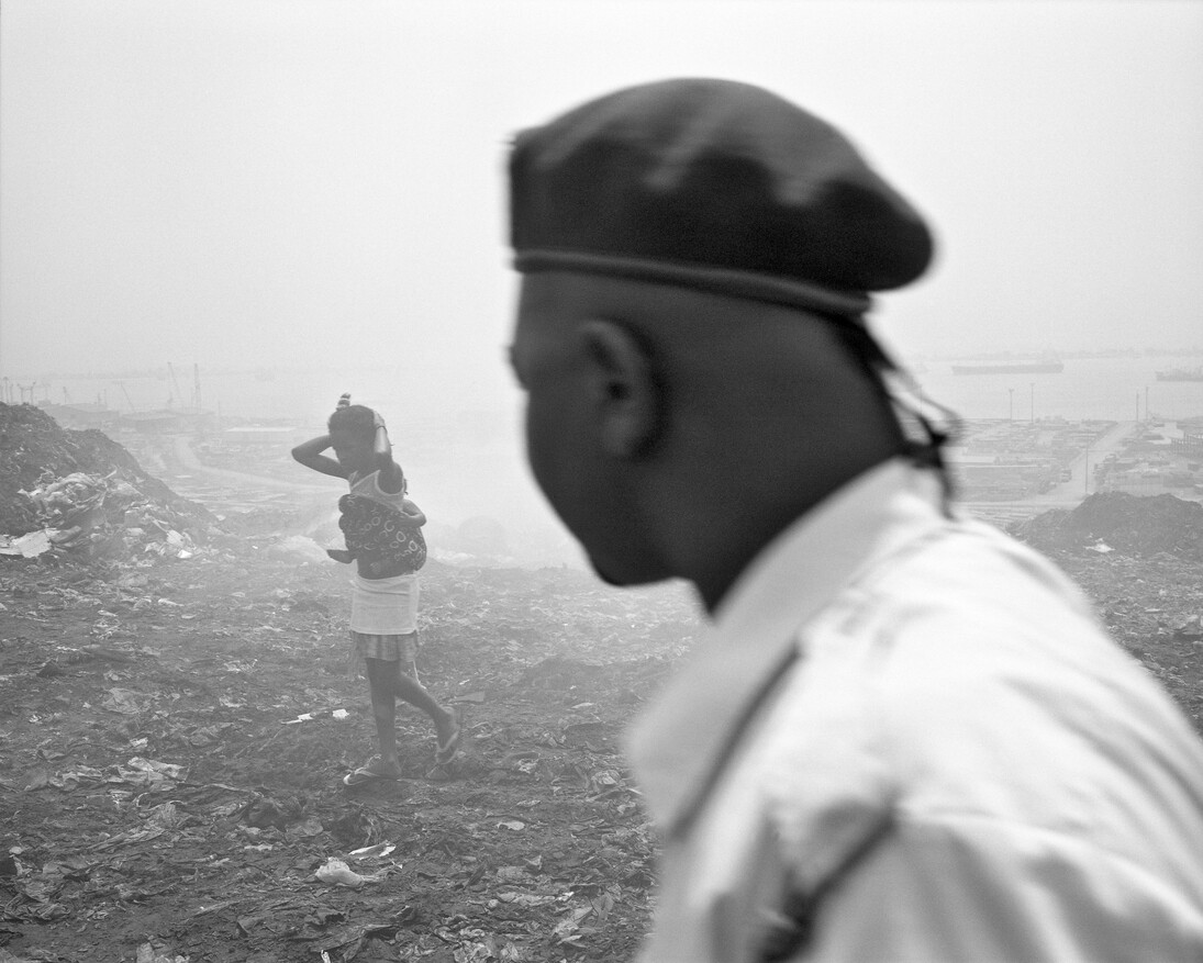 Jo Ractliffe (South African, born 1961)
Woman and her baby, Roque Santeiro market, 2007
From the series Terreno Ocupado
Inkjet print, 2015
On loan from the artist, courtesy Stevenson, Cape Town and Johannesburg
© Jo Ractliffe. Courtesy of Stevenson, Cape Town and Johannesburg