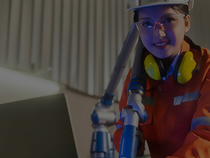 Optimize operations and ensure quality control: Asian female engineer specialist and technician maintenance utilize laptops to inspect and manage relay robot arm systems efficiently