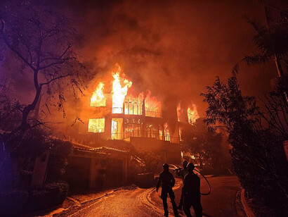 The image showcases USFS Engine personnel during the initial attack of the Eaton Fire, as they swiftly move to control the flames in the early phase of the wildfire in Los Angeles, USA