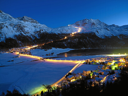 Snow-night at Corvatsch - View from Silvaplana towards the longest illuminated ski slope of Switzerland (4.1 km)