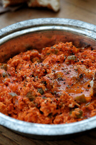A delectable serving of menemen is elegantly presented on the table