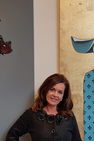 Lisbeth Lunda with her paintings Denial and Father, ph, Irene Kukota