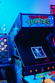 An old-school arcade with iconic Sega machines, representing the resurgence of retro gaming as a modern passion