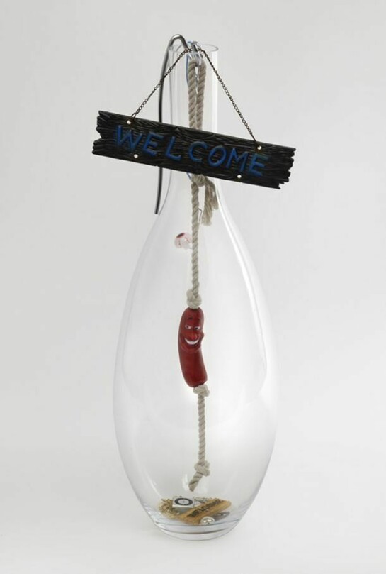 Jack Lavender, Welcome Into The Light 2013, Glass, welcome sign, metal, rope, plastic hot dog, apple shuffle, chains, dog key-ring, ear rings, plastic heart, plastic eye, 68x27x27 cm, 26.8x10.6x10.6 ins, AP-LAVEJ-00082