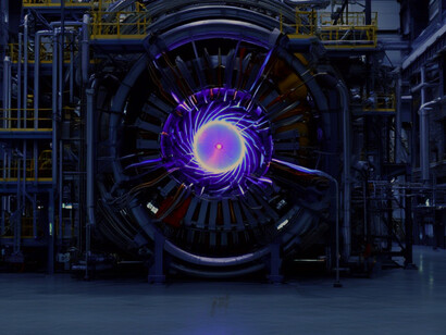 Perspektive der Fusionsreaktorsteuerung: Blick aus dem Kontrollraum auf die Fusionsreaktorkammer und die Lasersysteme