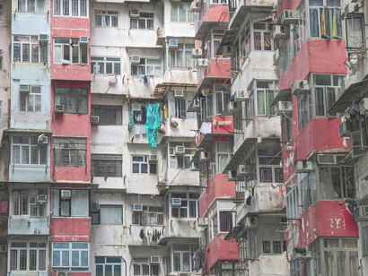 A residential building in the city highlighting overcrowded apartments and the visible signs of housing inequality and economic disparity