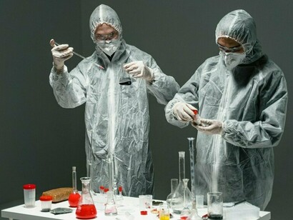 Scientists engaged in precise laboratory work, highlighting the calculated nature of the Klender experiment