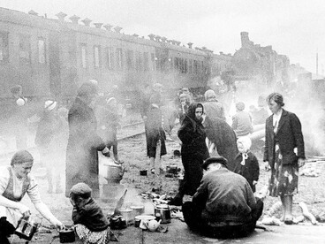 Evacuated residents of Leningrad preparing hot food during a train stop on the journey to Lake Ladoga, Soviet Union