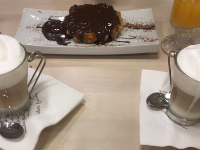 Breakfast waffles and two cappucinos