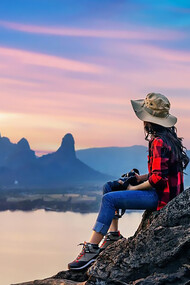 Tourist sitting on Phu sub lek viewpoint at sunset Lopburi Thailand