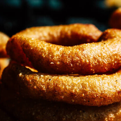 Sel roti is a popular Nepali rice bread known for its crispy texture and its distinctive round shape