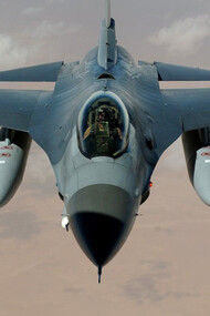 A jet plane soars through the skies