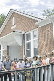 Previous students and teachers celebrate a school reunion and stand in front of what was once Carnegie High School in Marion, Virginia, USA. This school was an important site for the Black community in Smyth County