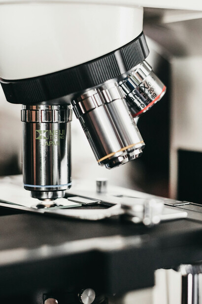 Microscope representing the intersection between biology and nanotechnology