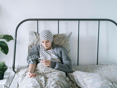 A patient in bed as they receive treatment for sickle cell disease