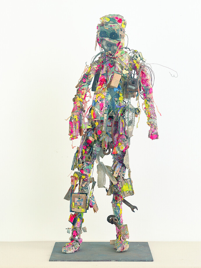 Shinro Ohtake, Radio Head Surfer, 1994-95, oil, oil paint, spray paint, photograph, cotton cloth, photographic film, printed matter, aluminum film, wire, cotton, plastic, iron, wood, snakeskin, thin paper, staple, plug, transistor radio, hemp cloth, vinyl, distribution cable, plastic sheet, earphone, nib, nylon thread, dry battery, iron plate, 82.6 x 33.4 x 18.6 cm, Courtesy of the artist and Take Ninagawa, Tokyo