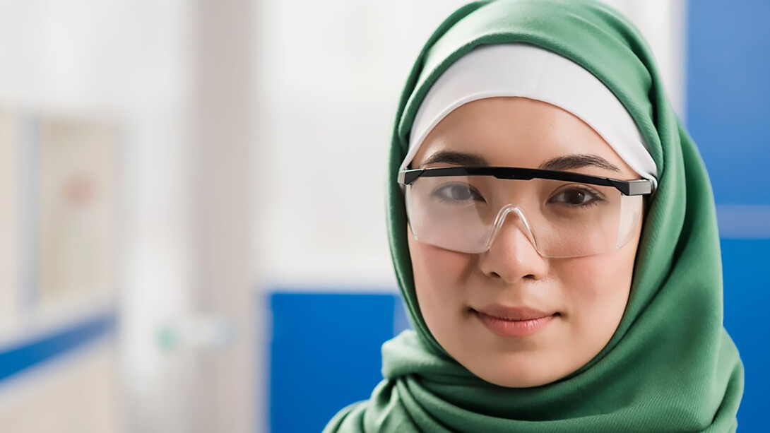Female scientist with hijab posing in the lab