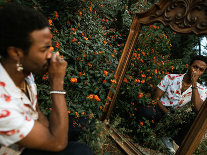 A young man staring at his reflection in isolation, capturing the emotional conflict and identity crisis caused by hidden truths and self-concealment
