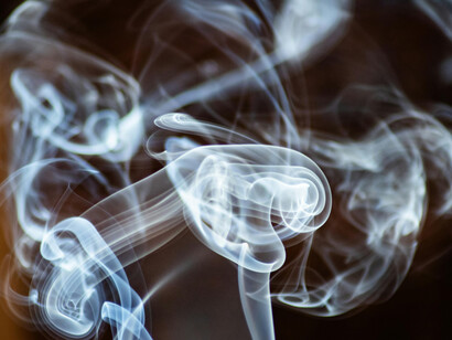 Smoke rising and dissolving into the air