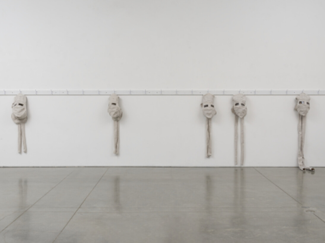 James Crosby, the Garrett Morgan safety hood allowing the wearer to breathe in a hostile environment, 2015, fabricated coat/hat rack, heavy canvas, polycarbonate welding lenses, 58 × 288 × 6in. (147.3 × 731.5 × 15.2cm). Courtesy of the artist and team (gallery, inc.), New York.